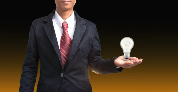 Man and light bulb in hand — Stock Photo, Image