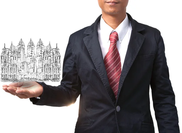 Business man holding drawing of modern building — Stock Photo, Image