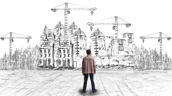 молодой художник, глядя на свой проект
