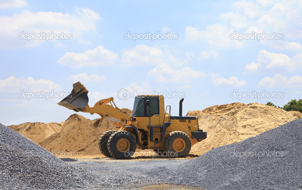 Yellow tractor on construction site