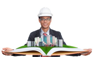 yeşil alan ile modern binanın kullanım için arazi ve gayrimenkul geliştirme yukarıda tutarak mimar