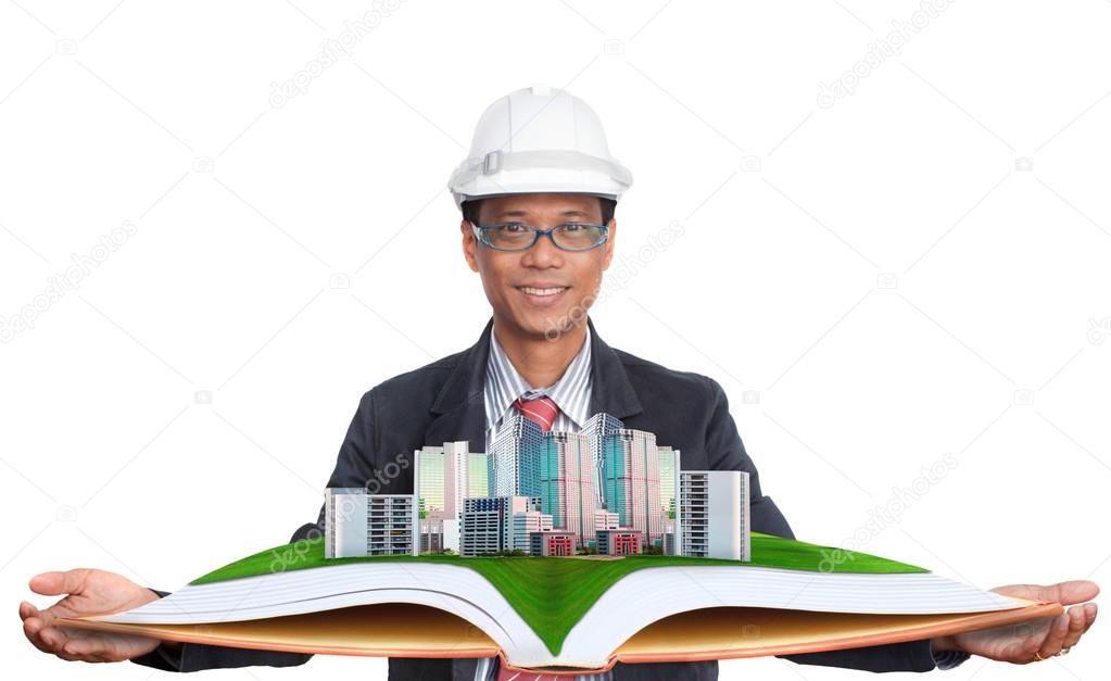 Architect holding green field with modern building above use for land and real estate development