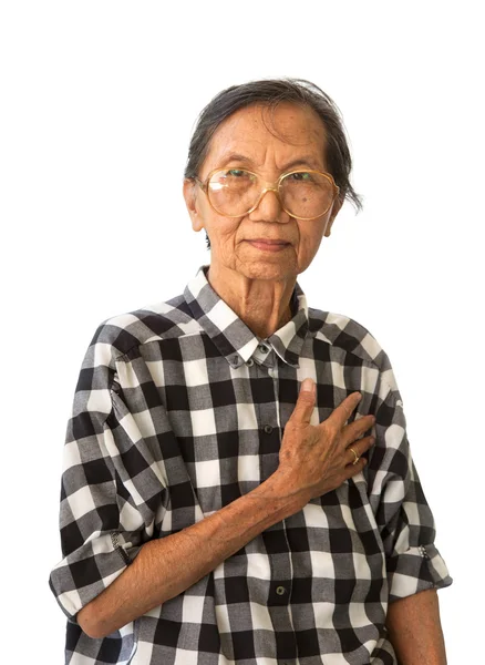 Senior woman touching her heart — Stock Photo, Image