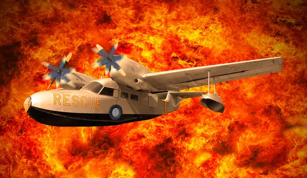 Rescue plane flying over fire burning — Zdjęcie stockowe