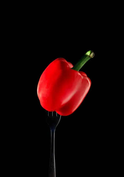 Red bell pepper on silver fork — Stock Photo, Image
