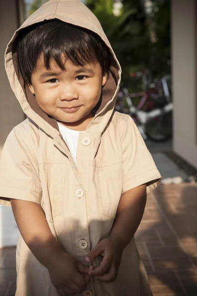 Young children wearing hood sweat with lovely face standing at h — Stock Photo, Image