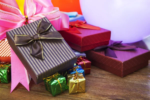 Stack of gift box lying on top wood table — Stock Photo, Image