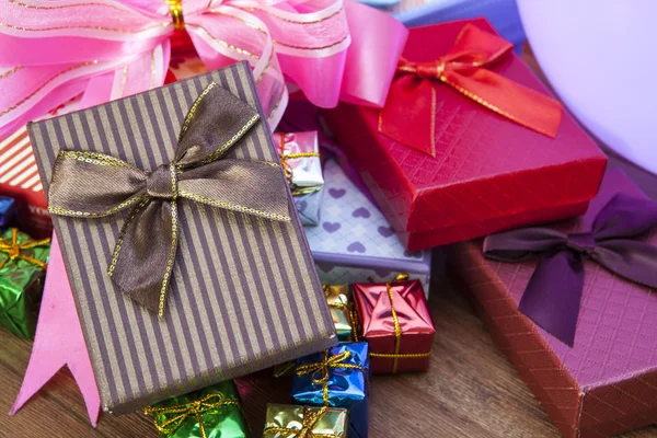 Stack of gift box lying on top wood table use for gift festival — Stock Photo, Image