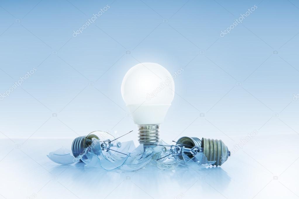 abstract of led light bulb glowing on light blue background with