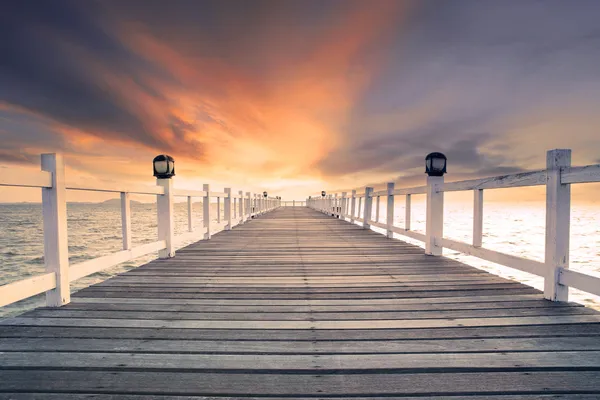 Old wood bridg pier with nobody against beautiful dusky sky use Stock Photo