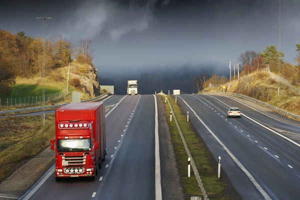 Trucking through scenic mountain pass — Stock Photo, Image