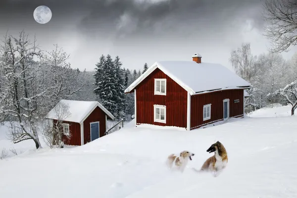 Old red cottages, winter landscape Stock Photo