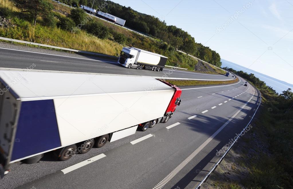 Trucks driving on scenic freeway