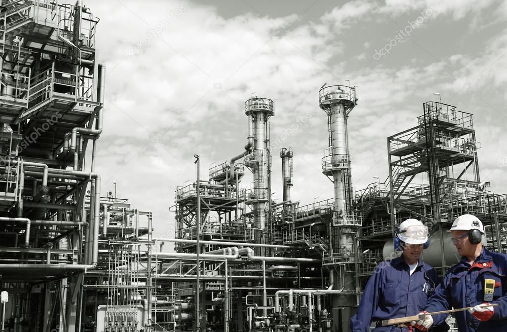 Oil workers inside giant refinery industry