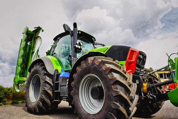 Giant tractor, tires and plow — Stock Photo, Image