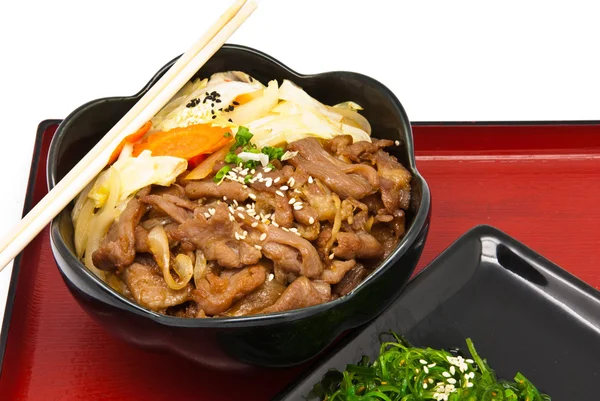 Rice with fried pork and seaweed Salad — Stock Photo, Image