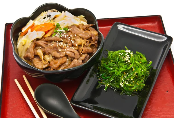 Rice with fried pork and seaweed Salad — Stock Photo, Image