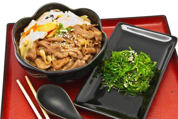 Rice with fried pork and seaweed Salad — Stock Photo, Image