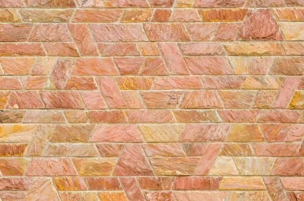 Desen kırmızı kayrak taş duvar yüzeyi — Stok fotoğraf