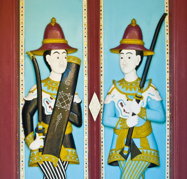 Wood carved paint in temple door — Stock Photo, Image
