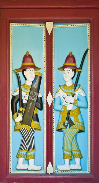 Wood carved paint in temple door — Stock Photo, Image