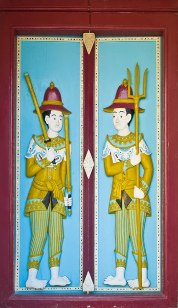 Wood carved paint in temple door — Stock Photo, Image