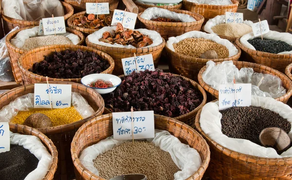 Spices and herbs in bamboo basket — Stock Photo, Image