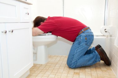 Man Throwing Up in Bathroom clipart