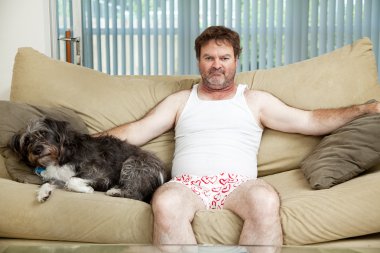 Couch Potato With His Dog clipart