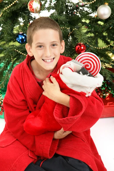 Little Boy Under Christmas Tree with Stocking — Stock Photo, Image