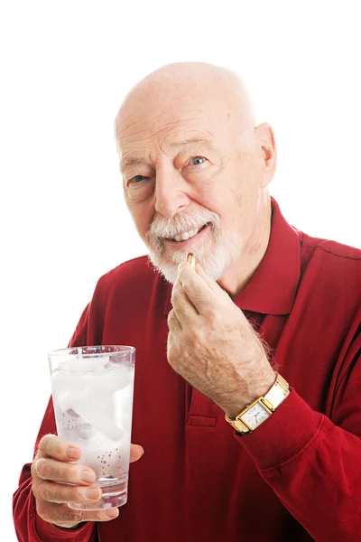 Senior Man Taking Fish Oil Capsule — Stock Photo, Image