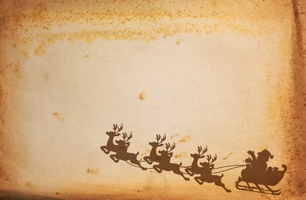 Урожай паперу і Санта-Клауса на санях з оленями — стокове фото