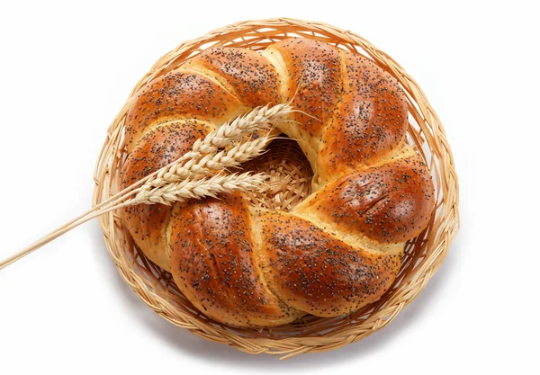 A fresh loaf of bread sprinkle with poppy seeds isolated on whit — Stock Photo, Image