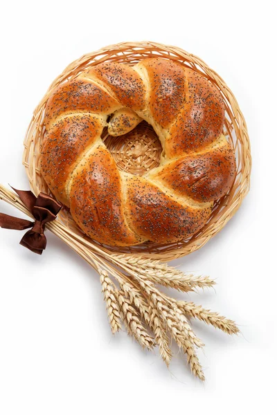 A fresh loaf of bread sprinkle with poppy seeds isolated on whit — Stock Photo, Image