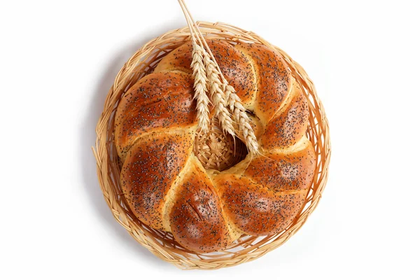 A fresh loaf of bread sprinkle with poppy seeds isolated on whit — Stock Photo, Image