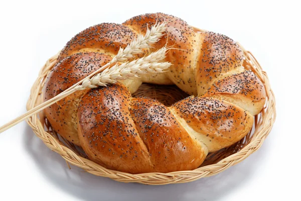 A fresh loaf of bread sprinkle with poppy seeds isolated on whit — Stock Photo, Image