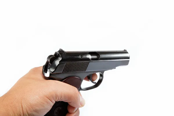 Pistola in mano su sfondo bianco . — Foto Stock