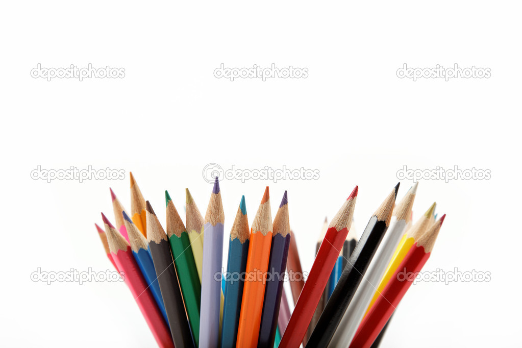 Close up of color pencils with different color over white backgr