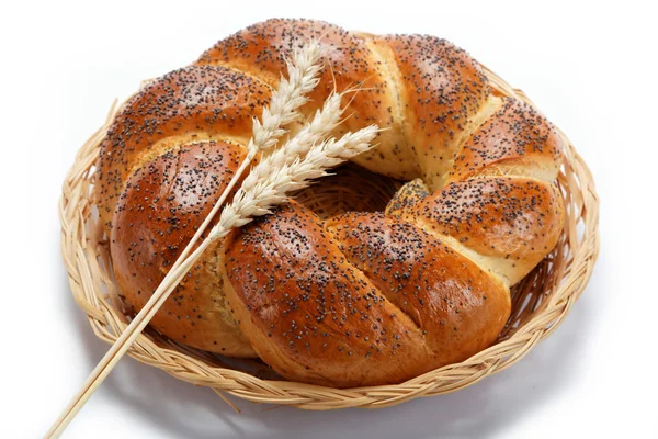 A fresh loaf of bread sprinkle with poppy seeds isolated on whit — Stock Photo, Image