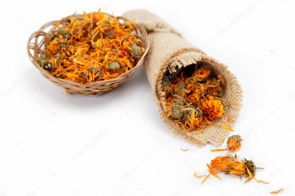 Herbs. Dried calendula or pot marigold flowers isolated on white