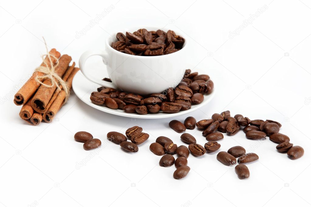Cup with coffee beans isolated on white background.