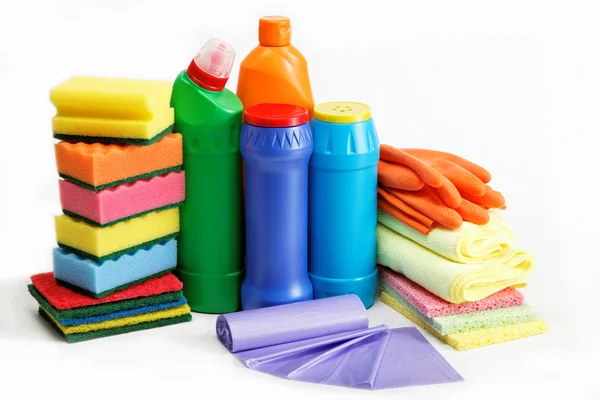 Detergent bottles, rubber gloves and cleaning sponge on a white — Stock Photo, Image