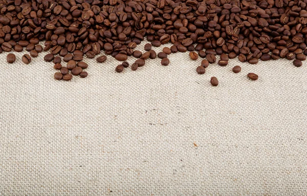 Coffee beans on sacking. — Stock Photo, Image