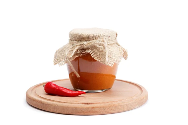 Squash caviar in glass jar and spices on a wooden board with whi — Stock Photo, Image