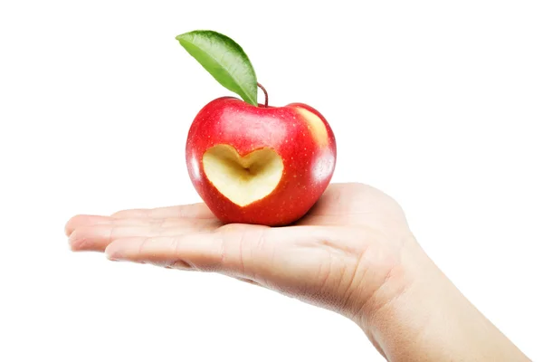 Женская рука с яблоком на белом фоне . — стоковое фото