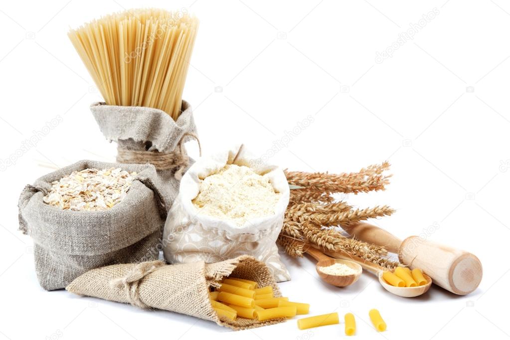 Flour, cereals, pasta in a canvas bag and ear on white backgroun