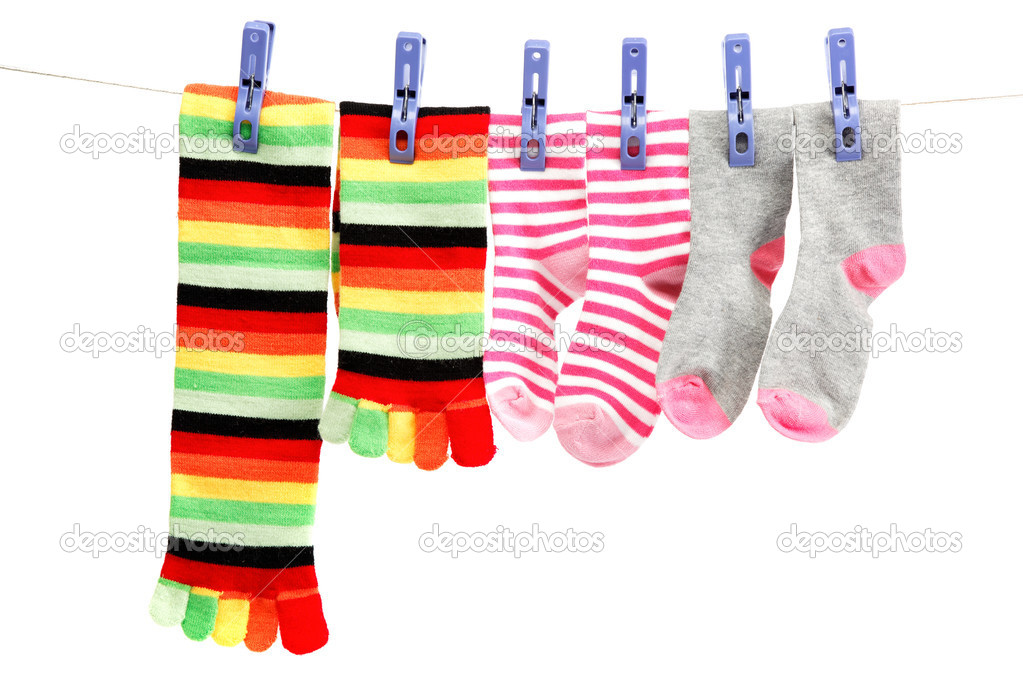 Colorful socks attached clothespin hanging from a rope.