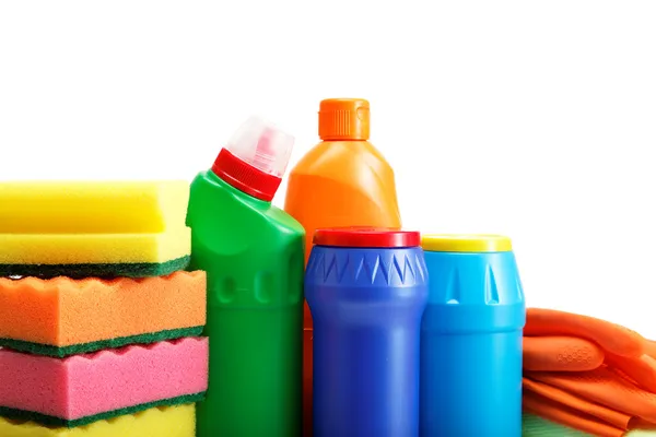 Detergent bottles, rubber gloves and cleaning sponge on a white — Stock Photo, Image