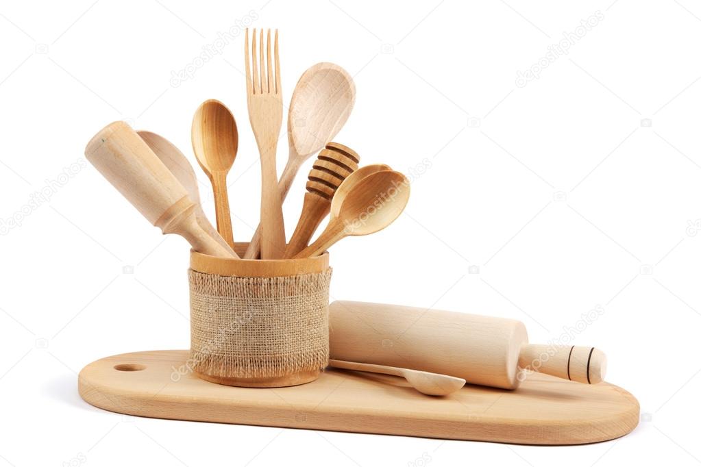 Wooden kitchen utensils isolated on white background.