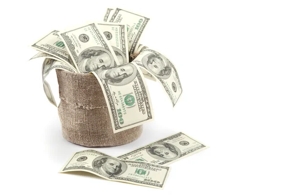 Billetes de cien dólares en un saco de lona aislado sobre fondo blanco —  Fotos de Stock